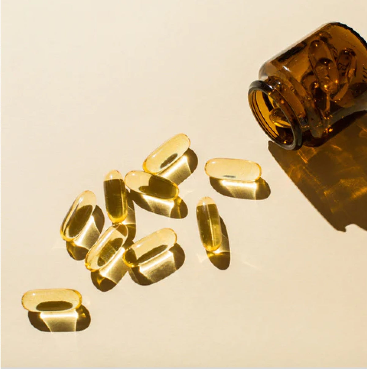 Softgel capsule spilling out of a jar